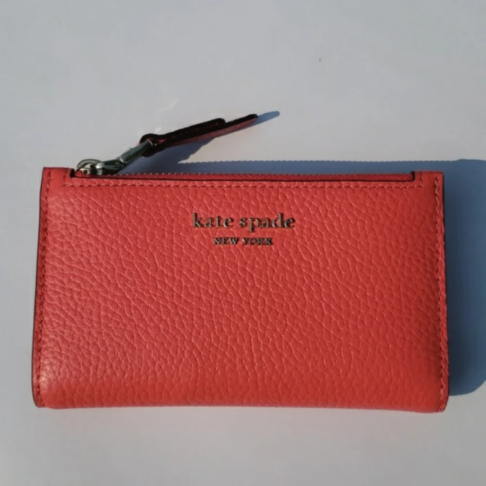 Kate Spade Leather Roulette Small Slim Bifold Wallet. Color: Peachmelba.